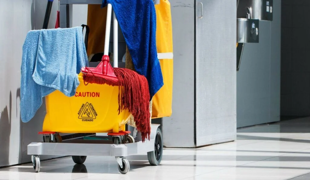 Cleaning supplies in janitorial roller bucket